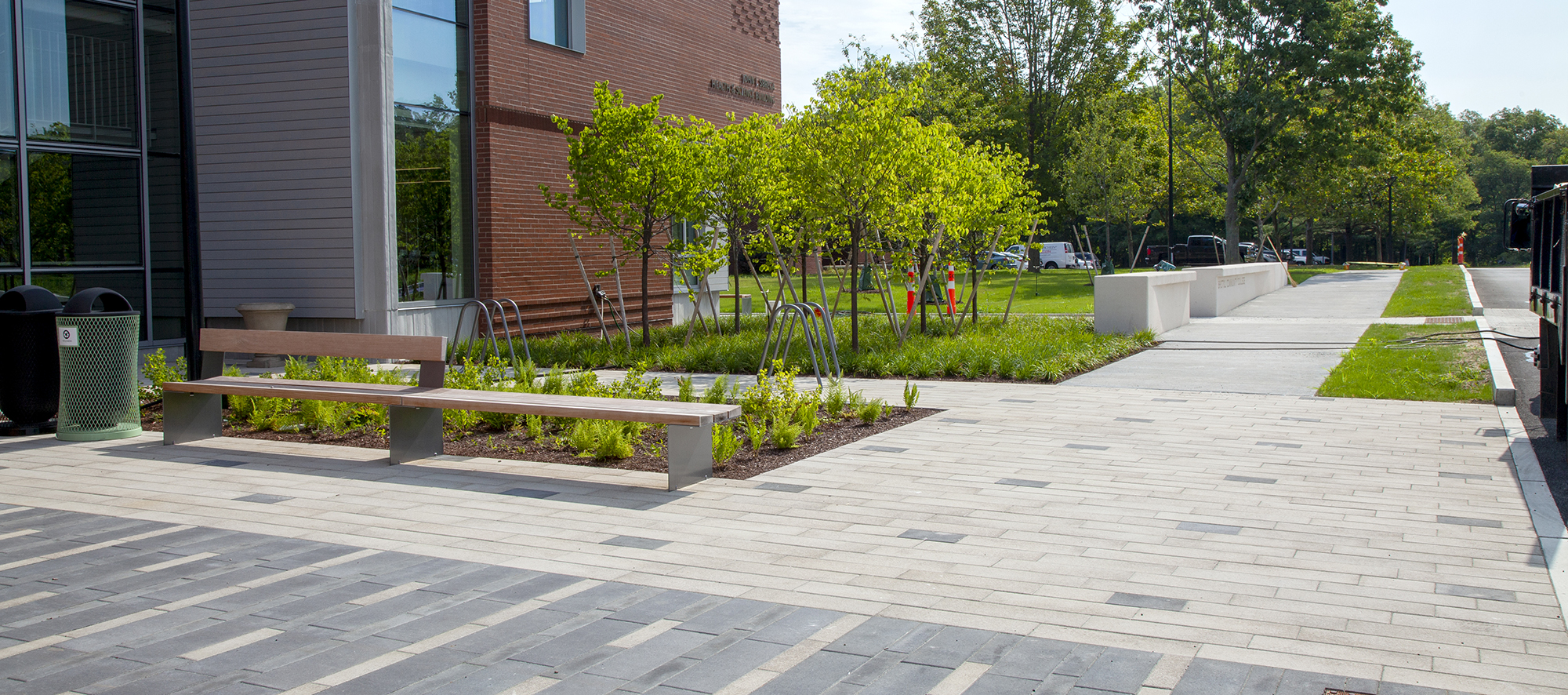 Bristol Community College has entrances paved with Promenade Plank Pavers, in block and dash patterns in contrasting colors.