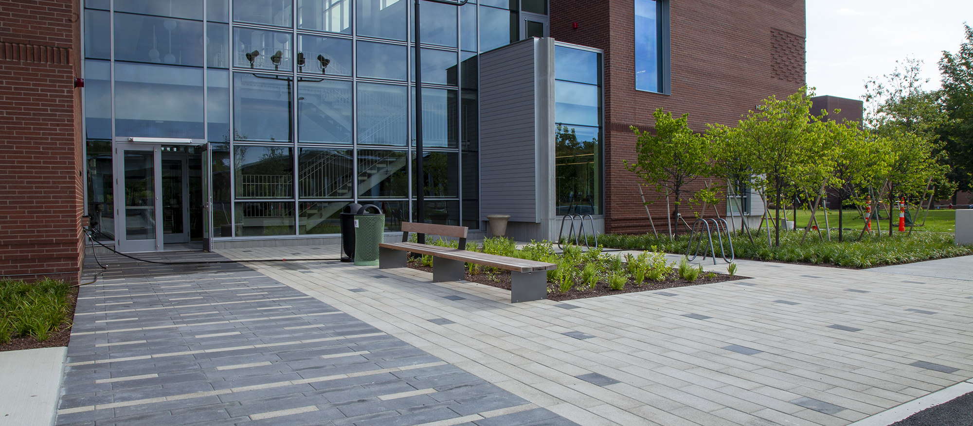 Bristol Community College has entrances paved with Promenade Plank Pavers, in block and dash patterns in contrasting colors.