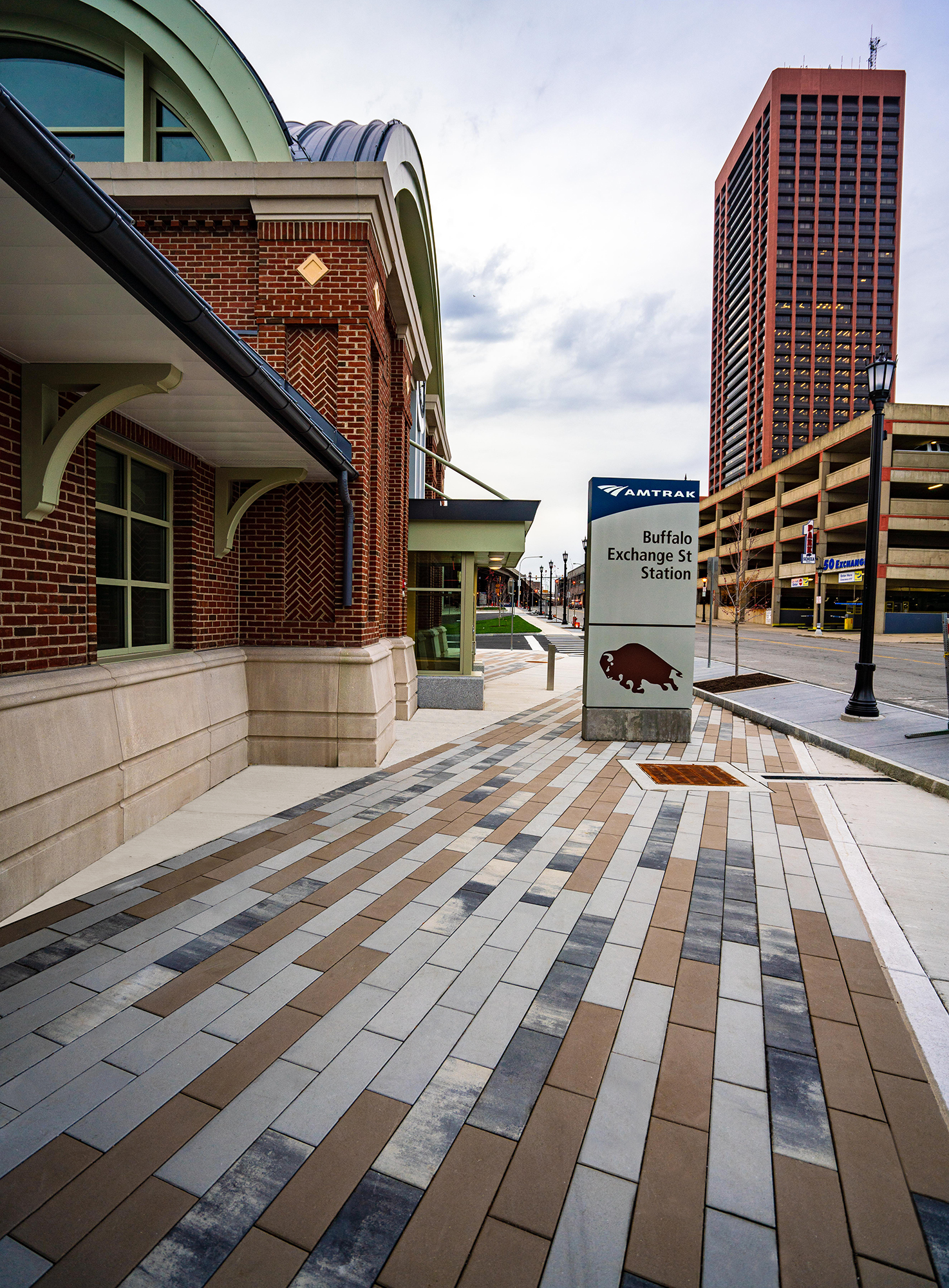 Buffalo Exchange Street Station is a historic building with the entry paved with three colors of Promenade Plank pavers in a linear pattern.